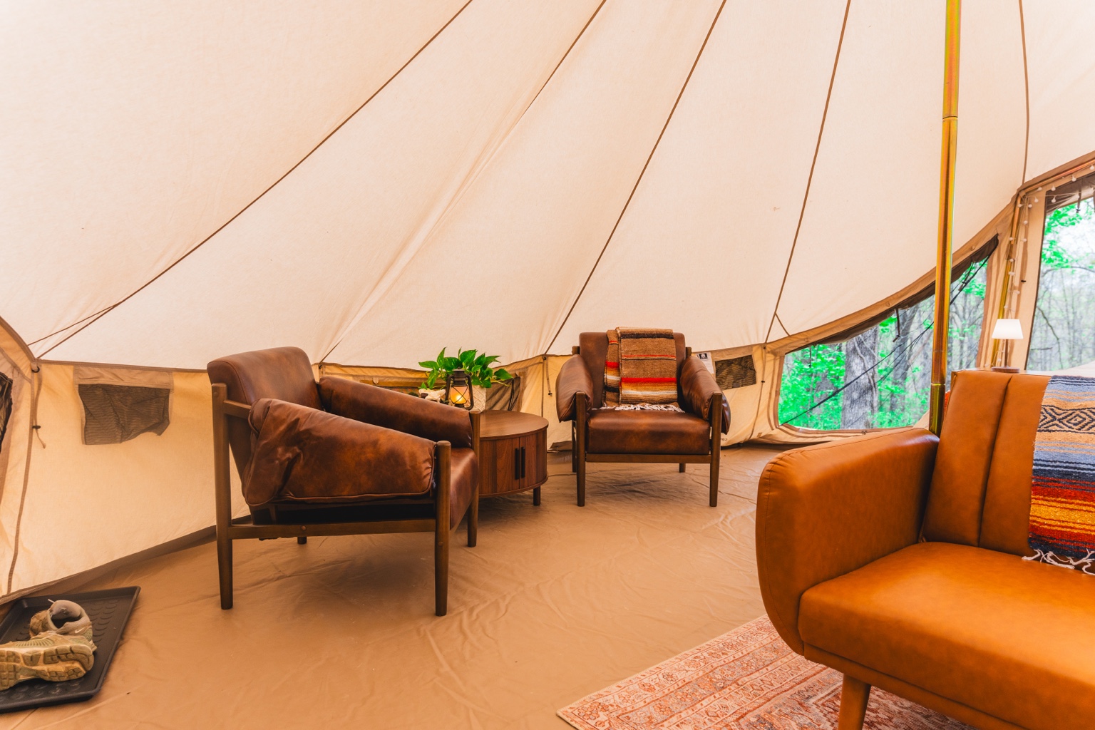 Leather lounge chairs inside Ozark Canvas Camp
