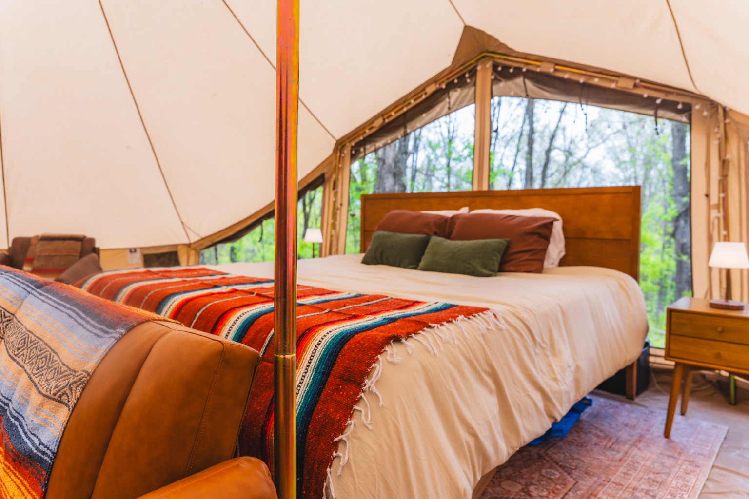 King bed inside Ozark Canvas Camp